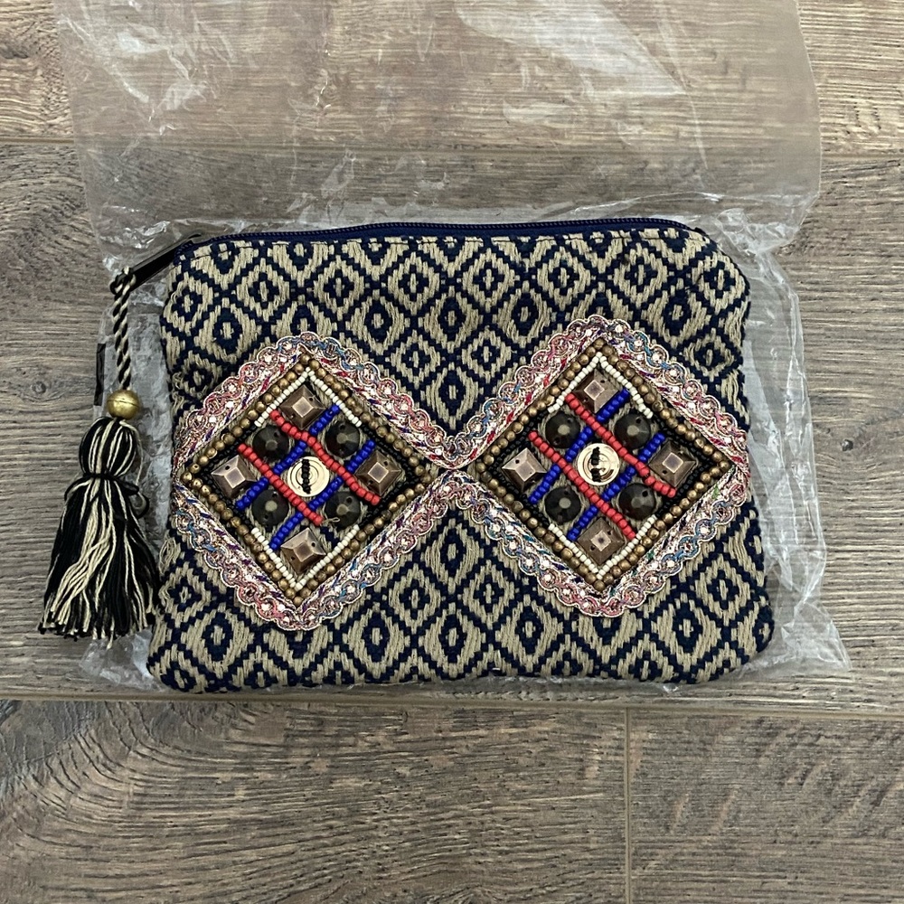 12th Tribe tassel beaded clutch. Brand new never used.